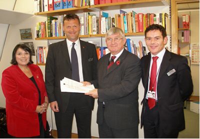 Dr Hywel Francis MP (second right) and Mrs Siân James MP presenting the petition to Mr Tim Bell and Mr Michael Vaughan of Arriva Trains Wales