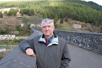 Dr Hywel Francis at Oakwood overlooking one of the Pontrhydyfen Viaducts