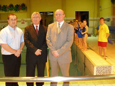 Mr Darren Evans, Poolside Manager at Cymmer Pool, Dr Hywel Francis MP, and Mr Paul Walker, Head of Operations discu ss Celtic Community Leisure's recent successes