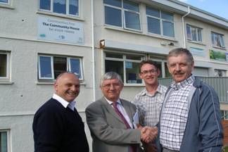 Dr Hywel Francis MP congratulates Barry Cosker on Briton Ferry West's Communities First Programme